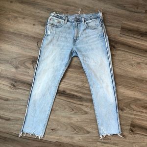 Levi 512s with unfinished and distressed seams size 30